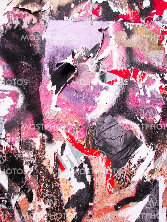 Wall with torn and shredded pieces of paper