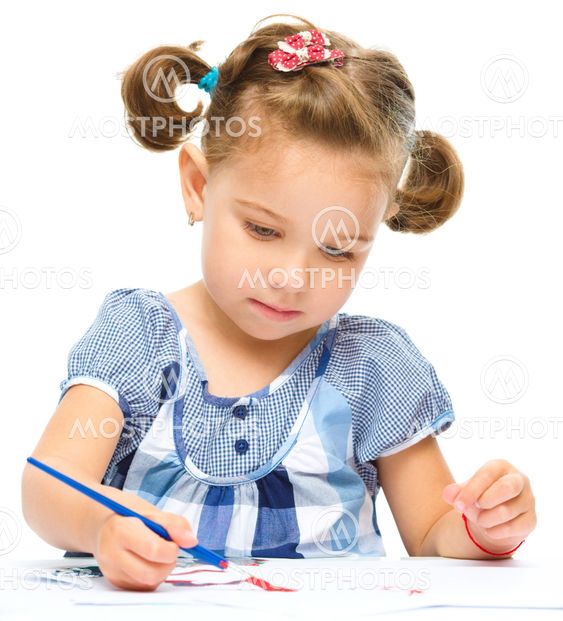 Little girl is painting with gouache