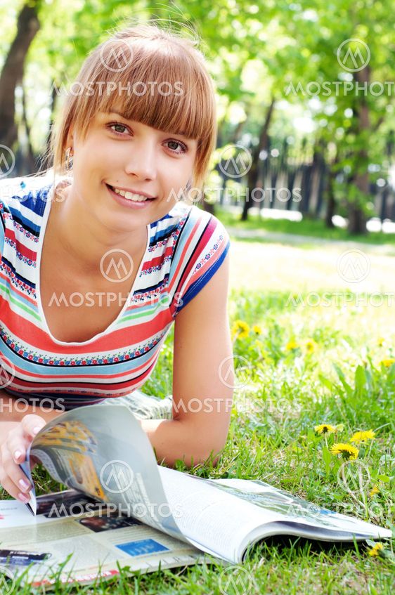 portrait of a beautiful woman in summer park