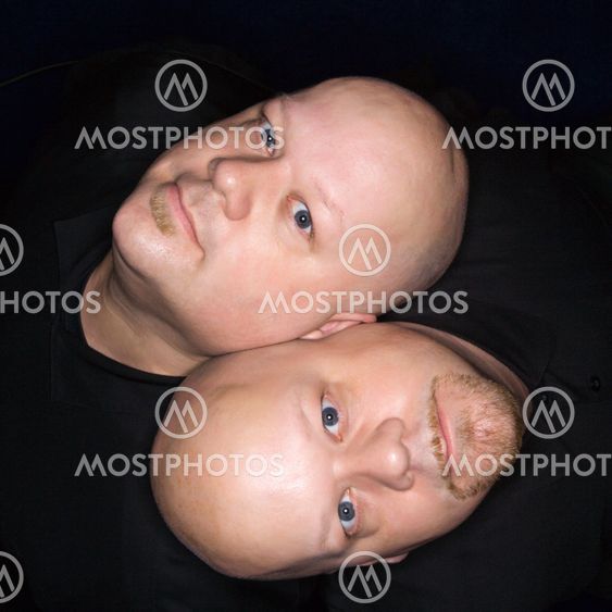 Twin bald men.