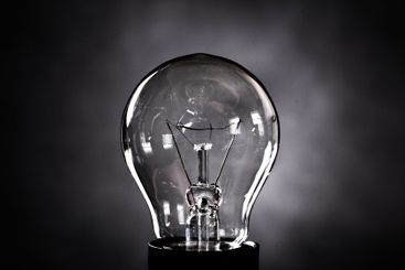 Close-up of electrical bulb on black background