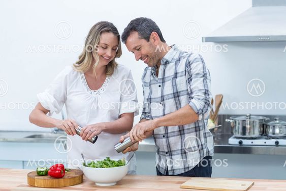 Pregnant couple in kitchen