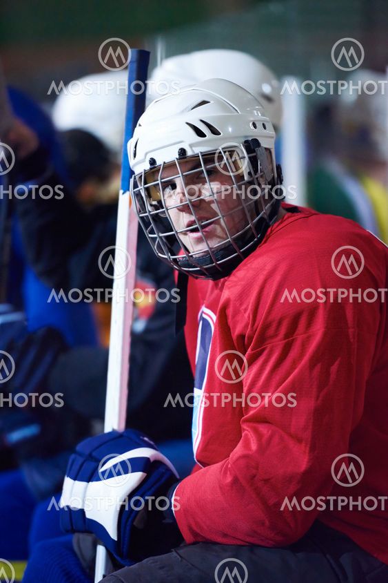 ice hockey players on bench