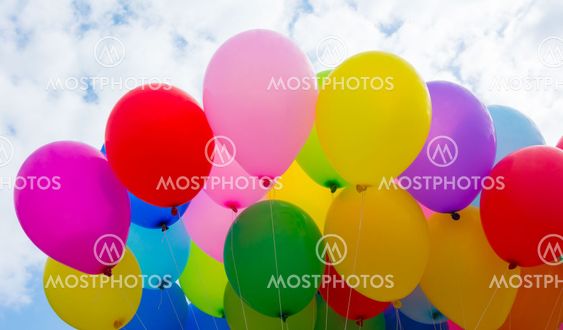 A colorful flying balloon in blue sky