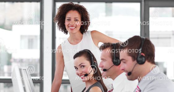 Charismatic female manager with her sale representative team