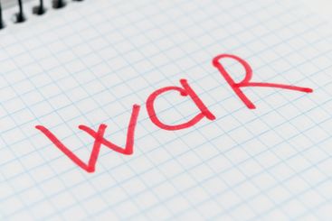 Word WAR in a notepad. Red text. Military occupation...