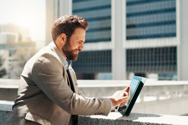 Business, tablet and man with internet, outdoor and...
