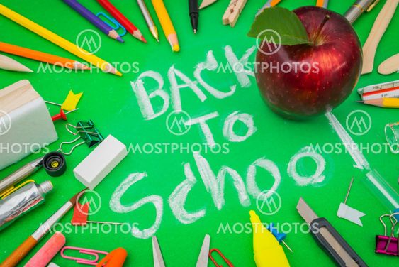 School supplies on Green chalkboard " Back to school...