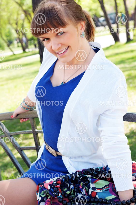 portrait of a beautiful woman in summer park