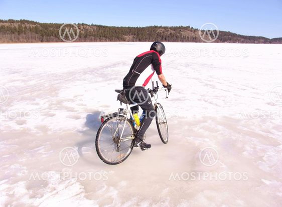 Cyclist on frozen sea