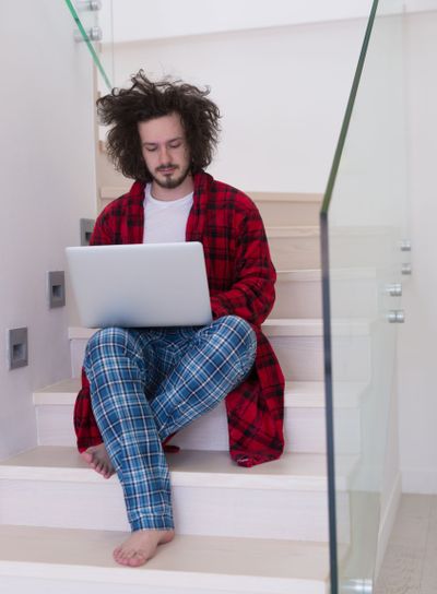 freelancer in bathrobe working from home