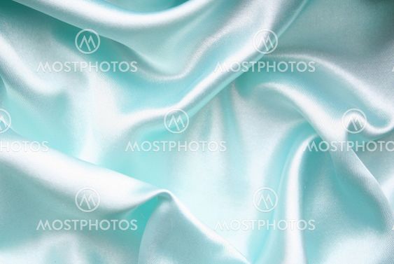Smooth elegant blue silk as background