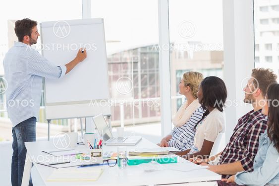Man presenting an idea to his co workers