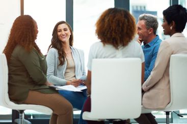 Professional, workshop and business people in circle in...