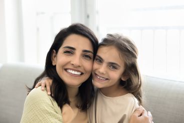 Closeup portrait beautiful mother and daughter cuddling...