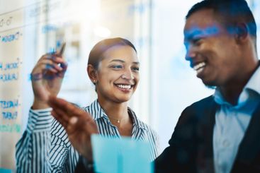 Office, meeting and glass wall for writing, smile and...