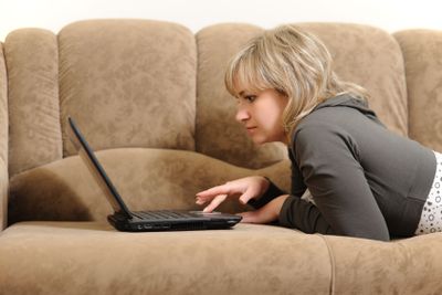 The woman working on laptop at home