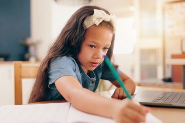 Girl, learning and writing with pencil, homework and...