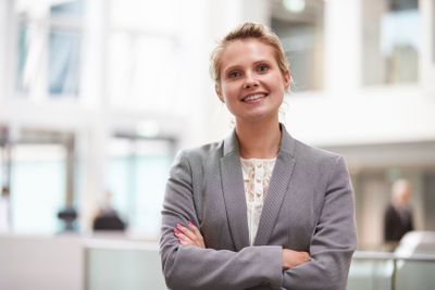 Head And Shoulders Portrait Of Businesswoman In Office