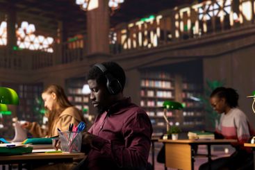 African american guy student uses ambient focus music to...