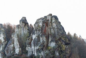 Large rocky rocks on a background of water. Rocks of...