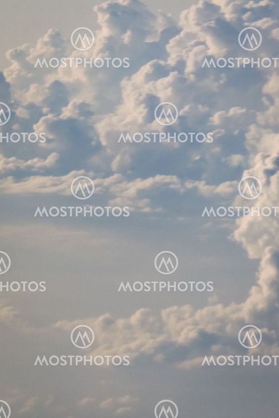 dramatic blue sky with clouds and sun rays
