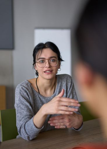 A close up portrait of a young businesswoman engaged in...