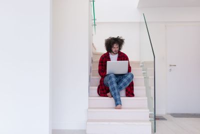freelancer in bathrobe working from home