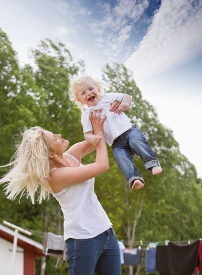 Mother playing with baby