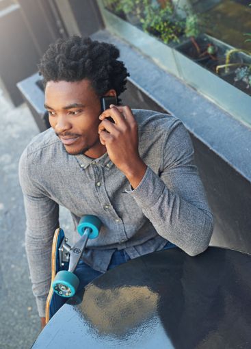 Black man, phone call and outdoor cafe for conversation,...