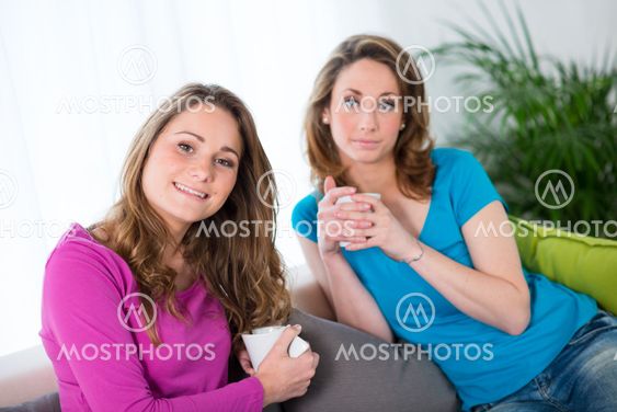 portrait of two beautiful girls at home