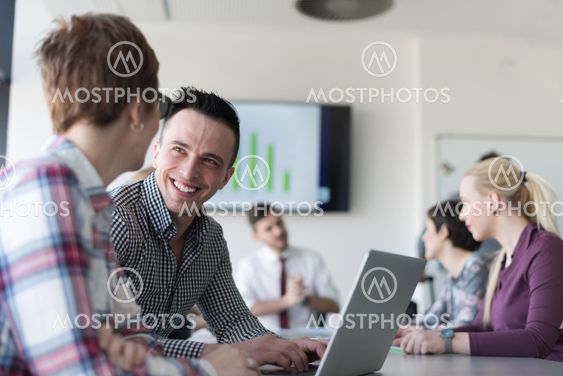 young business couple working on laptop, businesspeople...