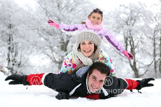 Family playing in the snow