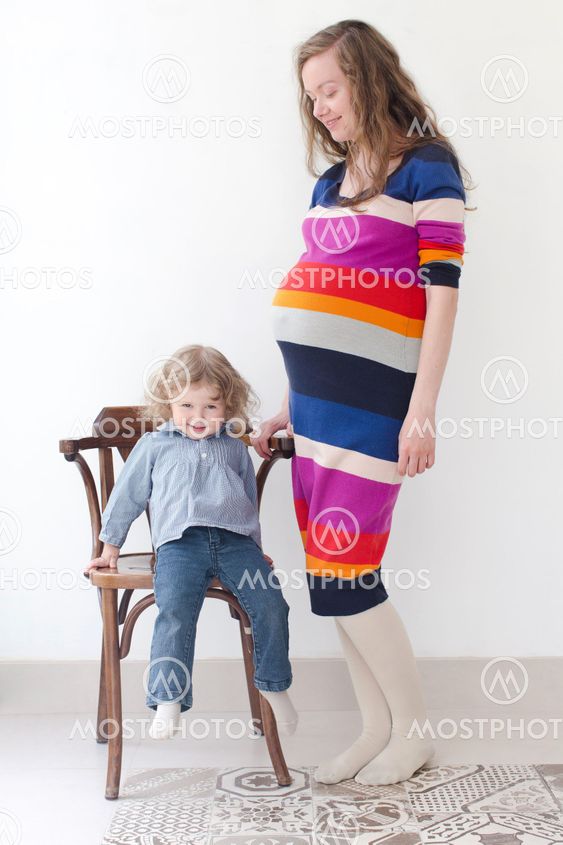 Full body portrait young pregnant woman daughter