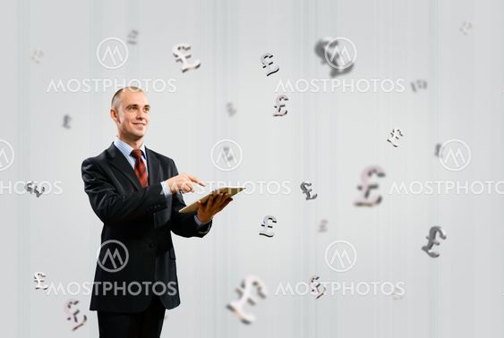 man working with a Tablet, money concept