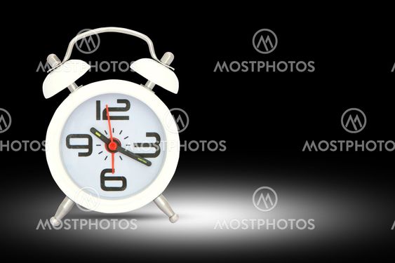 alarm clock isolated over black