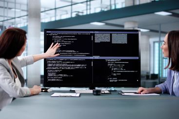 Female programmer using pair programming methodology