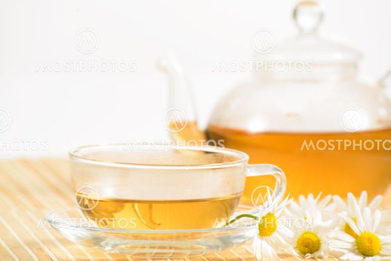 teacup with herbal chamomile tea