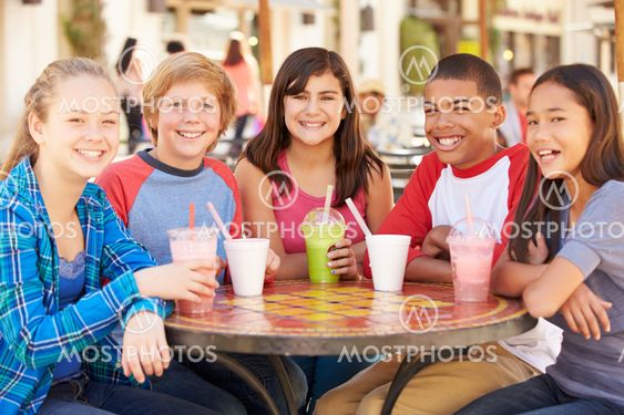 Group Of Children Hanging Out Together In CafŽ