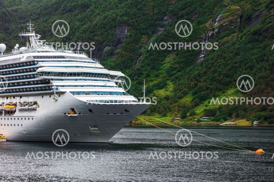 cruise liner anchored in fjord
