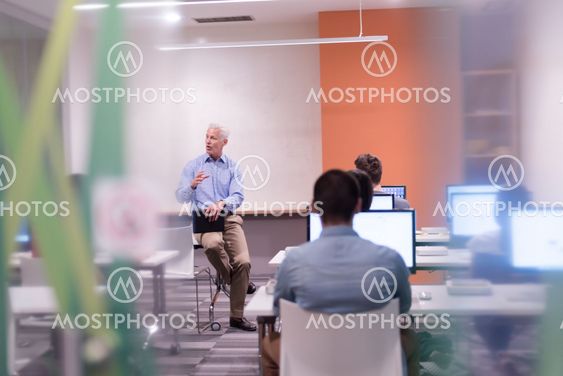 teacher and students in computer lab classroom