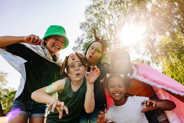 Portrait of happy children gesturing and making faces...