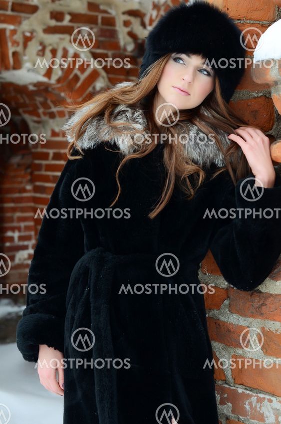 The beautiful woman brunette in winter
