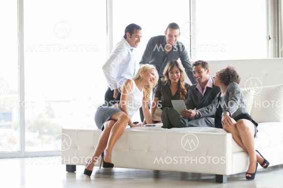 Group of young people getting together after work before a party