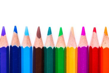 Vibrant assorted colored pencils arranged neatly on a...