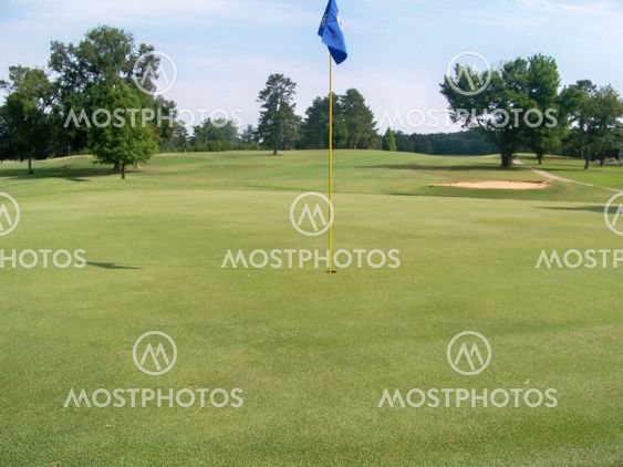 blue flagged golf hole