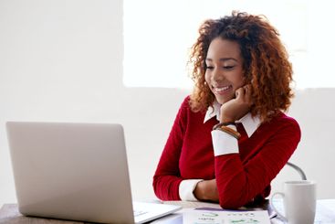 Laptop, reading and business black woman in office for...
