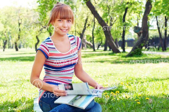 portrait of a beautiful woman in summer park