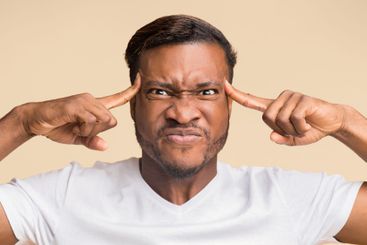 Black Man Concentrating Hard Pointing Fingers At...