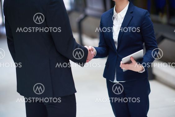 business man and woman hand shake